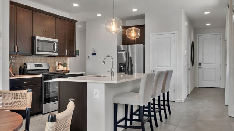 a kitchen with a table and chairs and a table