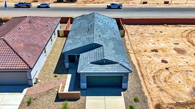 a house with a blue roof and a brown roof
