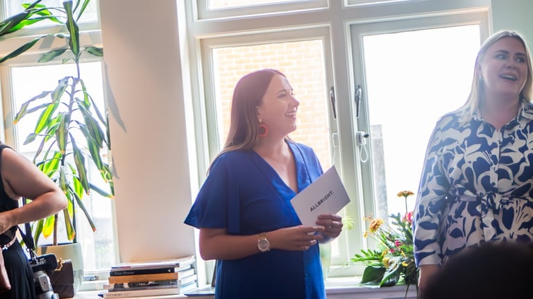 Stephanie Garey hosting and presenting at a networking event and dinner 