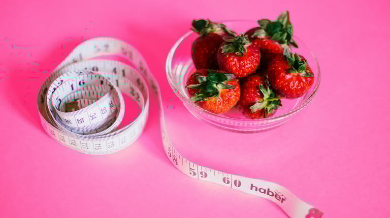 a bowl of strawberries and measuring tape measure tape measure tape measure tape measure tape