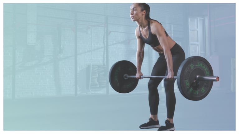 Athletic woman performing a barbell deadlift exercise in a gym for strength training.