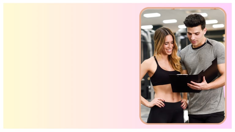 A personal trainer showing a fitness progress chart to a woman in a gym setting.