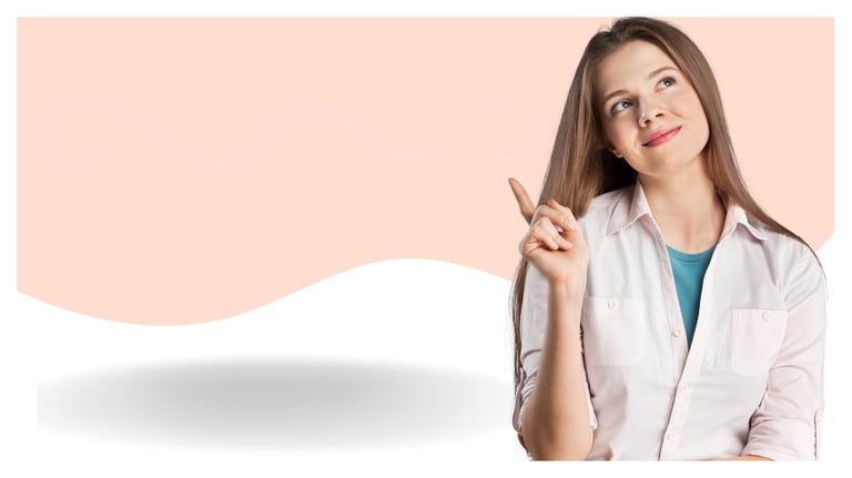 A thoughtful young woman points up toward copy space on a peach and white background.