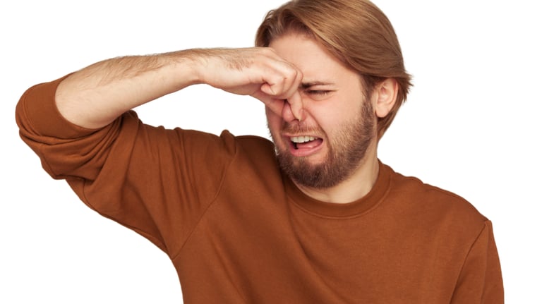 dog waste is stinky man reaction pinched nose