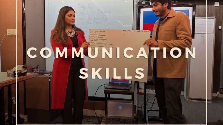 Corporate training - captain Zaira standing in front of a white board with a participant
