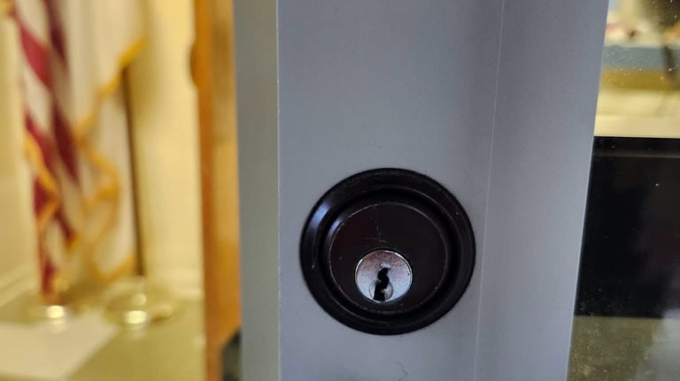 Close up of a commercial door lock and handle on a business entrance
