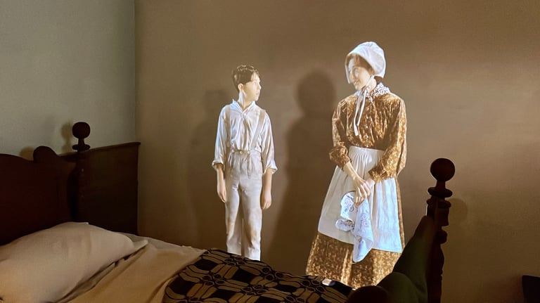 mother and son holograms in a bedroom