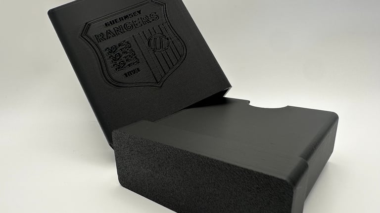 Custom 3D printed black Guernsey Rangers logo storage box.