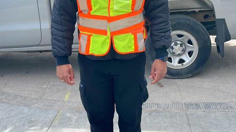 A male security guard from Baig Security actively mobile patrolling the area