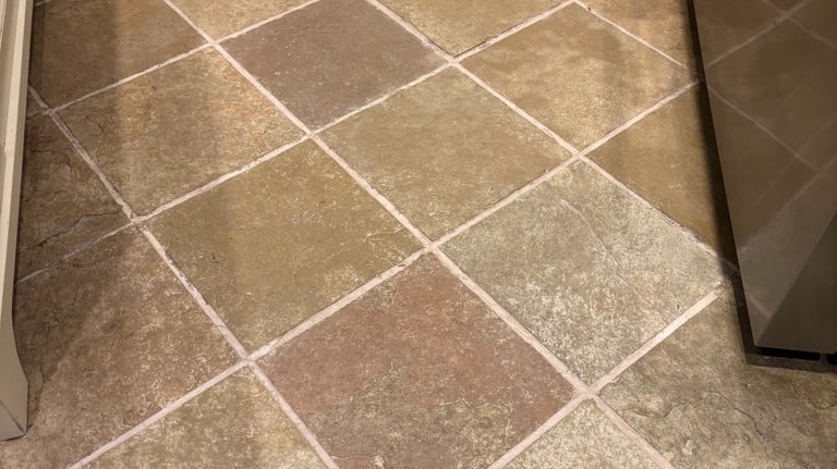 Clean and restored slate tile floor in kitchen after professional cleaning