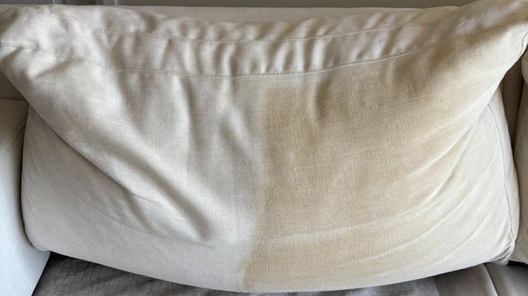 Couch showing side-by-side before and after professional cleaning