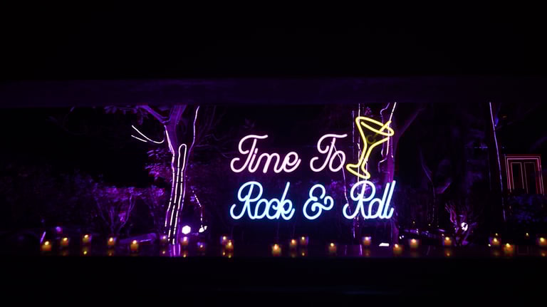 a neon sign that says time to rock and roll