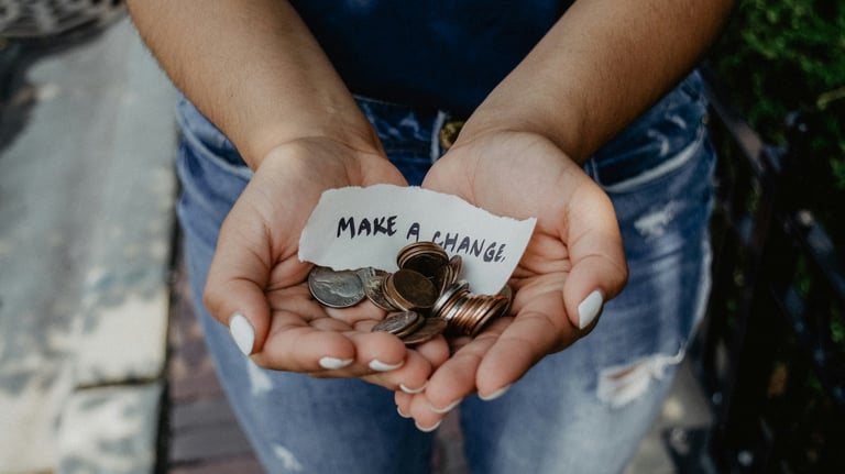 https://unsplash.com/photos/person-showing-both-hands-with-make-a-change-note-and-coins-K0E6E0a0R3A