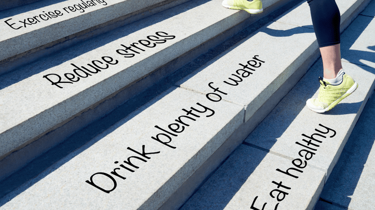 a person running up stairs with quotes ' eat healthily, drink plenty of water, reduce stress'
