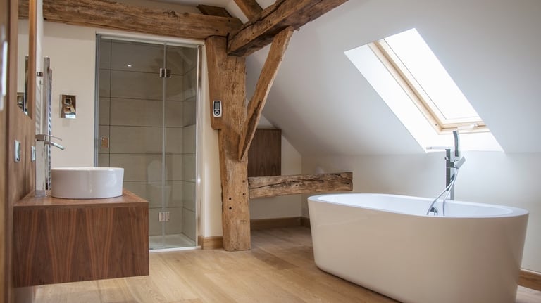 A modern bathroom in an oak barn