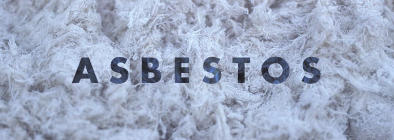 a pile of asbestos and a sign that says asbestos to us