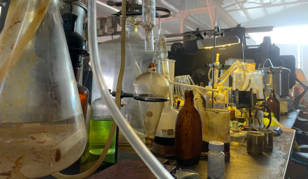 a bunch of bottles of liquid and chemicals in a illegal drug lab