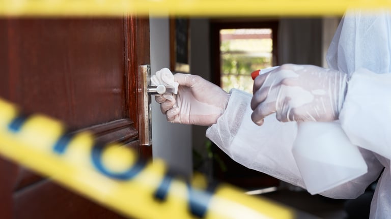 a person in a white lab coat and gloves holding a knife and a knife in