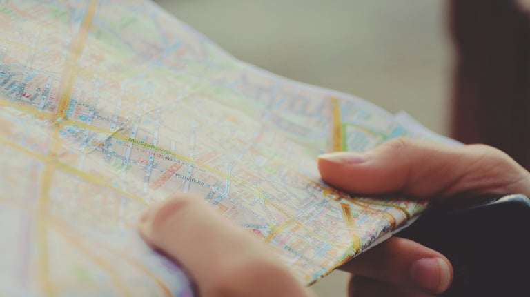 a person holding a map of a map