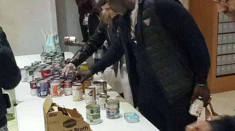 Residents of the Hotel Cecil picking up food at our food bank