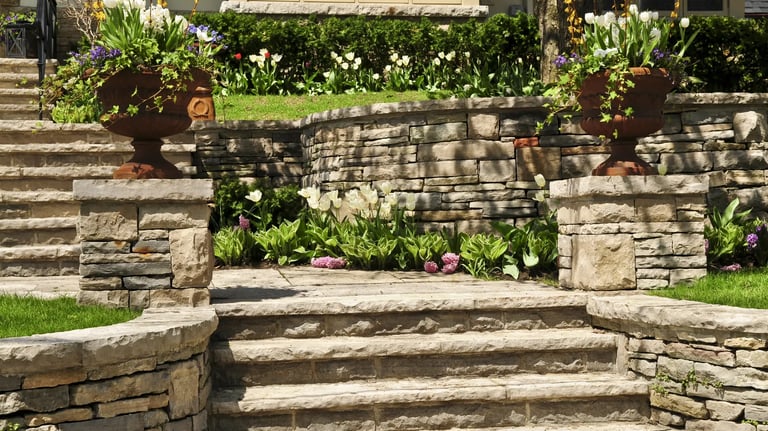 Beautiful stone retaining wall installation by West Linn Concrete, improving landscape design and functionality.