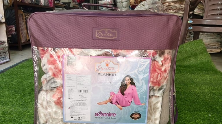 "Signature branded blanket, high-quality fabric design for premium retail and hotel supply."