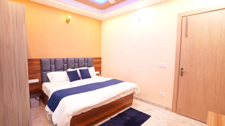 a bed room with a bed and a ceiling fan