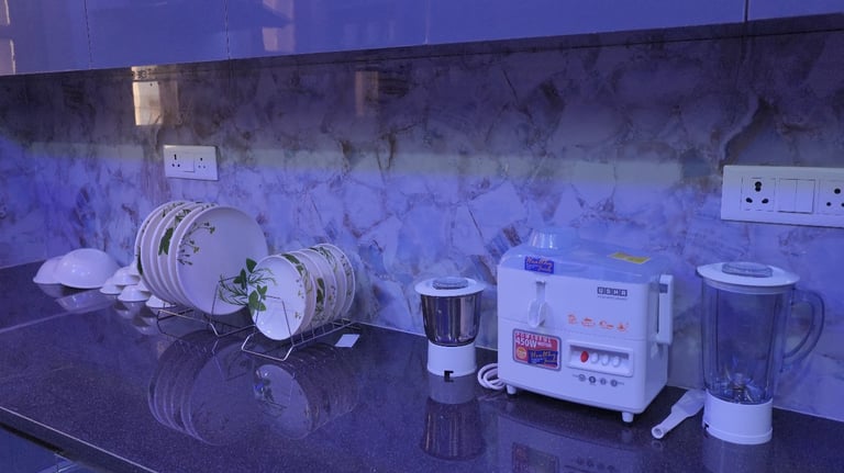 a kitchen counter top with a blender 