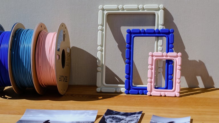     Customizable 3D printed photo frames placed on a wall in a home decor scene