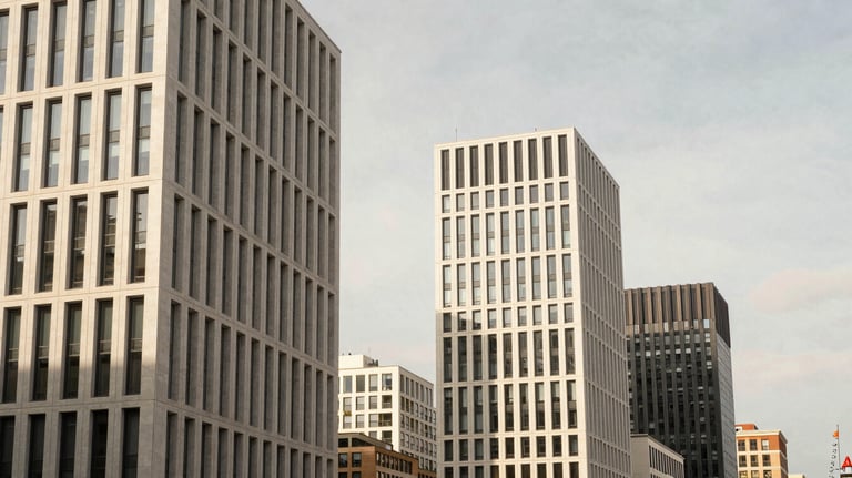 A high-end travel photograph of a modern cityscape in Europe, with sharp lines and sophisticated lighting in soft off-white and warm tan.