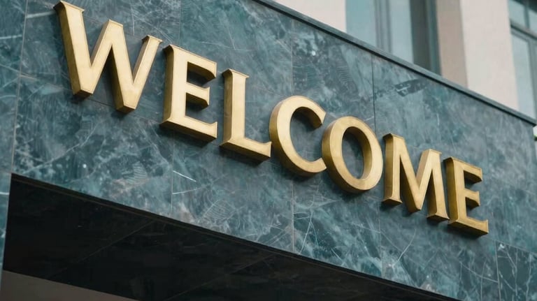 An architectural detail shot of a modern school entrance in Pakistan, showing gold lettering on a dark teal stone wall. The style is premium and welcoming.