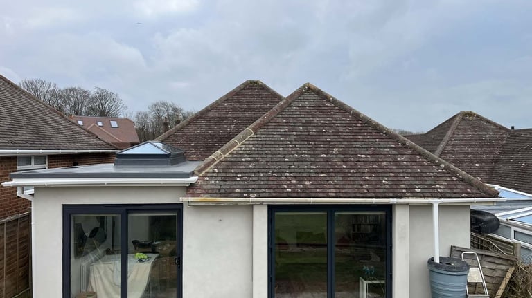 Completed bungalow rear extension with large sliding doors and modern exterior finish.