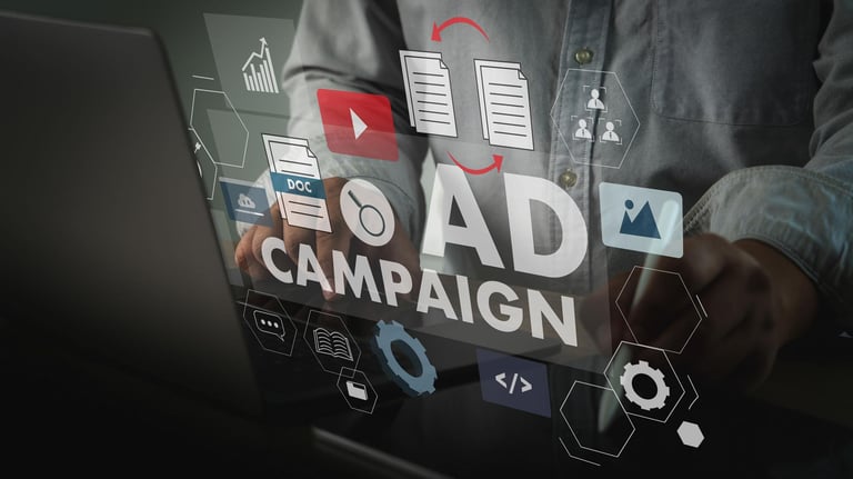 Digital marketer managing an online ad campaign on a laptop with holographic marketing icons and data analytics.