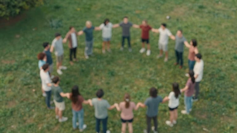 An aerial view of a group of people standing in a circle holding hands in a park, representing community and unity. The image features colors like #3D5B5F and #A2B2AE.
