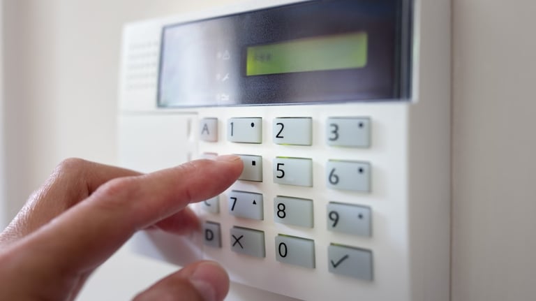 a person pressing a button on a keypad