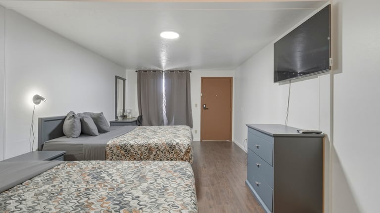 Patriot stay Motel Vernal Ut. Room with tow queen beds, large tv, hotel and motel furniture vernal