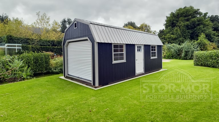 Black and white barn-style shed with roll-up door - Texarkana storage shed