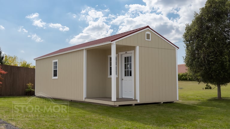 Tan portable cabin shell with front porch - Caney Creek Sheds