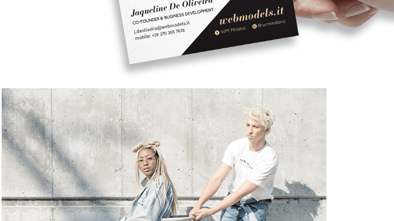 a person holding a business card with a business card