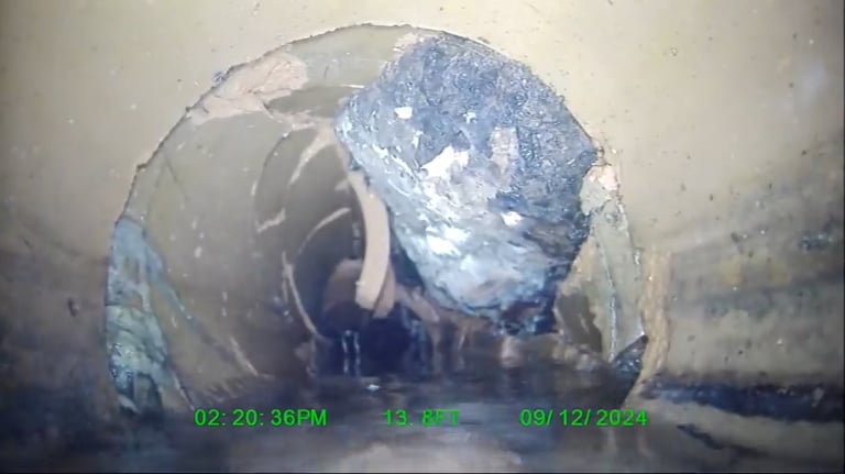 Sewer inspection find. Broken tile with heavy roots.