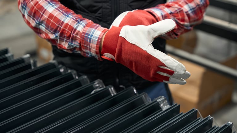 a person wearing gloves and gloves holding a glove