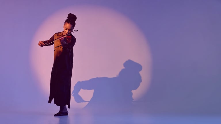 Dj ps at a wedding with a woman playing the violin