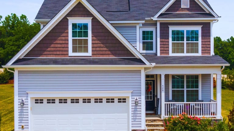 a house with a garage door and a garage door