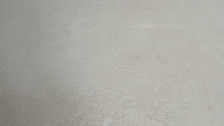 Designer laminate flooring installed by Tswanacrete Botswana for high-end interiors, delivering elegance and long-lasting