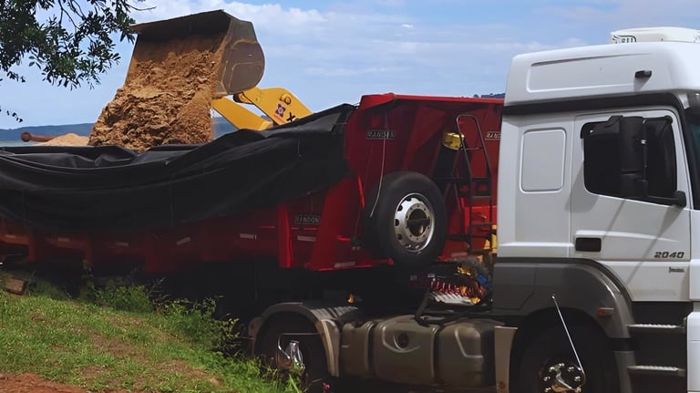 a truck with a large load of sand on it