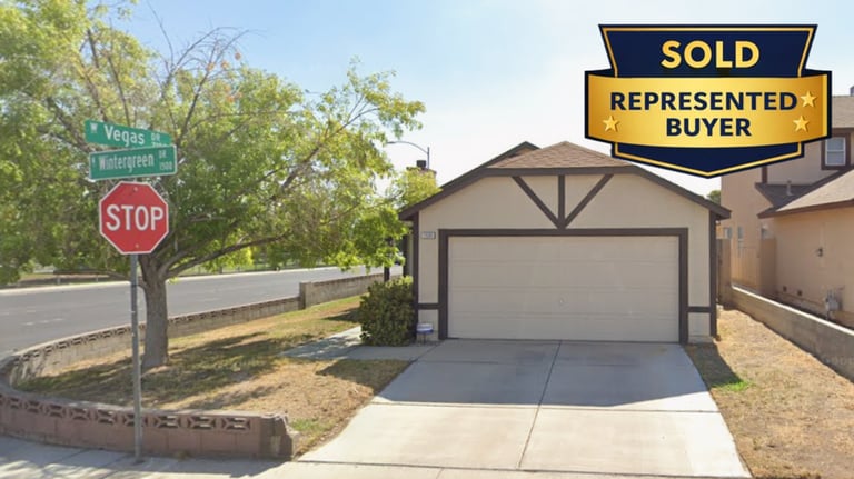 a sold sign for a home in a neighborhood