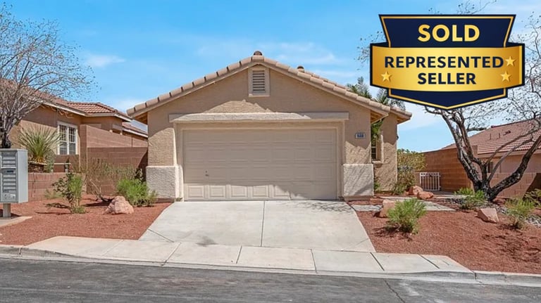 a sold sign for a home in a residential neighborhood