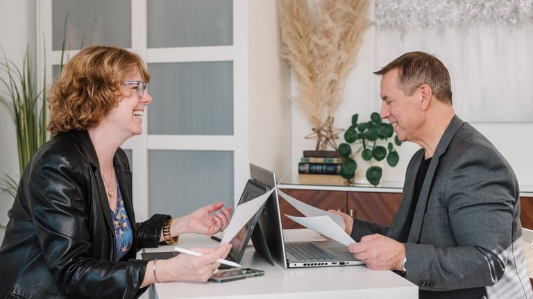 Allen and Susanne working together at a desk