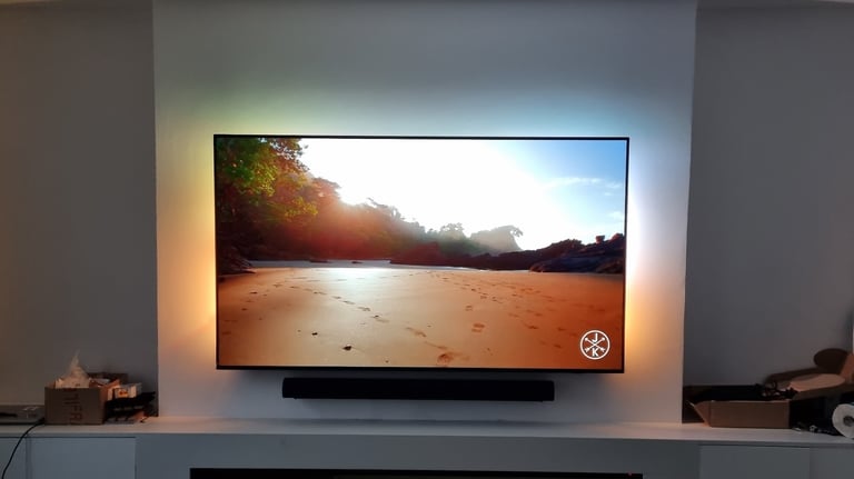 Professional TV wall mounting with hidden cabling in a Milton Keynes living room.