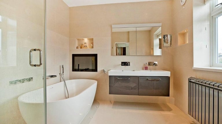 Waterproof mirror TV installation in a luxury London bathroom by MountMyTV